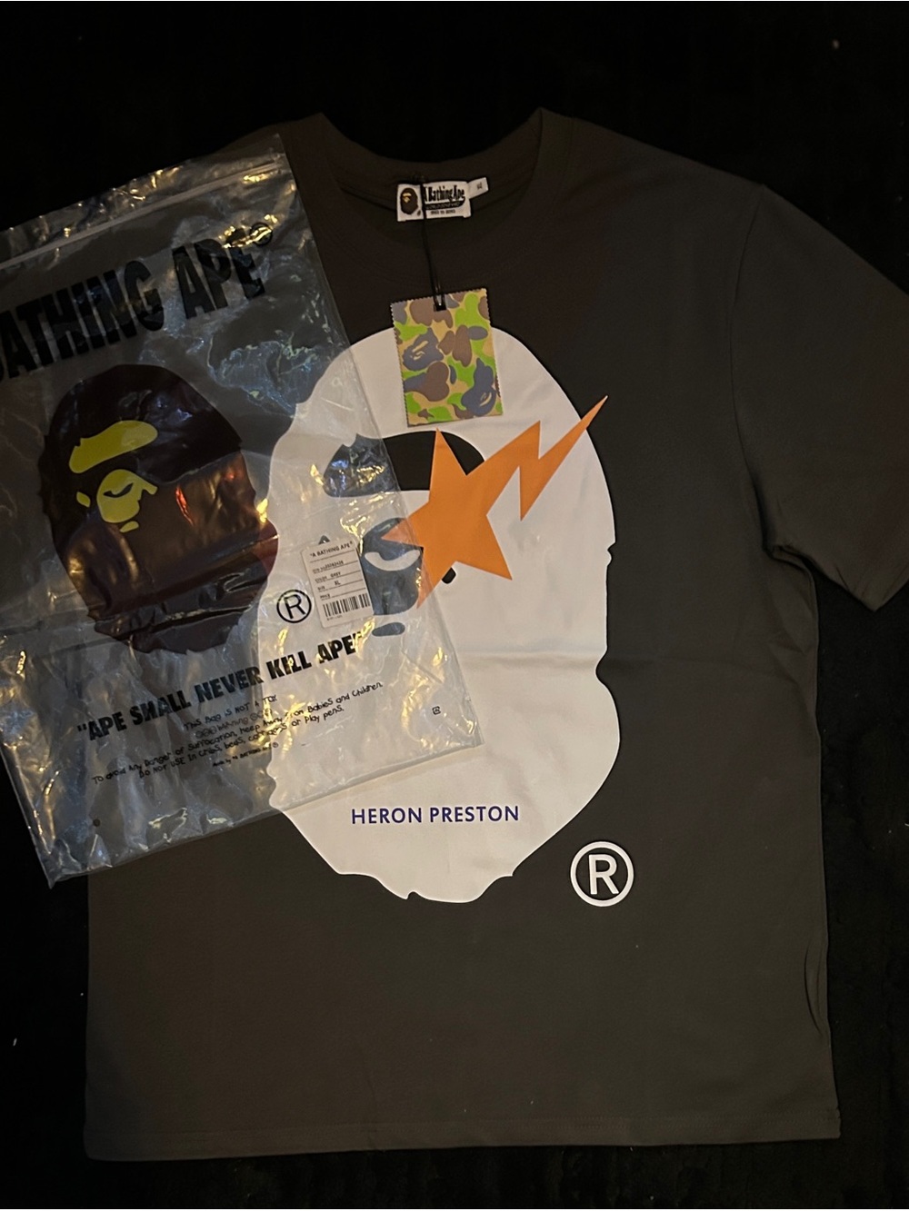 Heron Preston Charcoal Tee with White Face & Orange Star Bolt